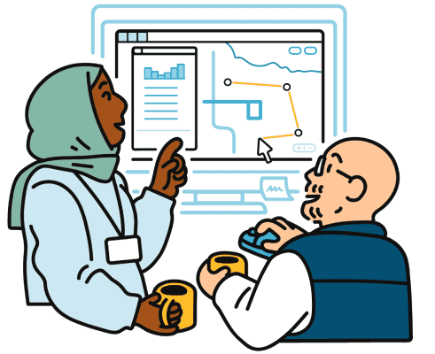 Two transit agency employees adjust a bus route together on a computer.